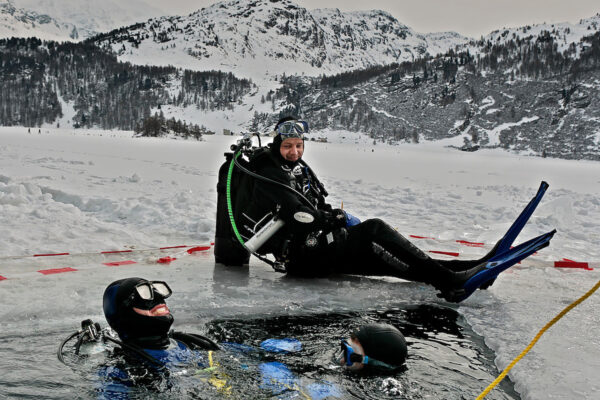 Winter athletes looking for a challenge are drawn to extreme sports like ice diving in Lake St. Moritz in Switzerland. A hole is cut in the frozen lake for the scuba divers, but at night a foot of ice forms over it, so the following morning, the hole must be reopened.
After the initial shock, some divers find the experience claustrophobic. Diving in subzero temperature requires advanced diving skills and a desire for adventure.
