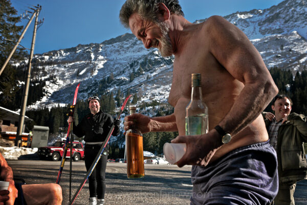 Athletes like these Italian men on a holiday break out the homemade grappa to have a good time. The friends were having a good time skiing and drinking near Lucomagno Pass in Switzerland. Tourists are drawn to Switzerland’s alpine climate and landscapes and for vacations and mountain sports.
