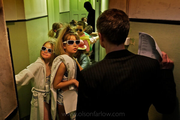Glamorous young models gather backstage dressed in stylish sunglasses and designer swimwear for a fashion show held at Badrutt’s Palace Hotel, a luxurious retreat in St. Moritz.
The Swiss hotel is internationally known for its glitz and glamour opened in 1896 and is owned and operated by the same Badrutt family, now in their third generation. The event was a charity event raising funds for a local hospital.
