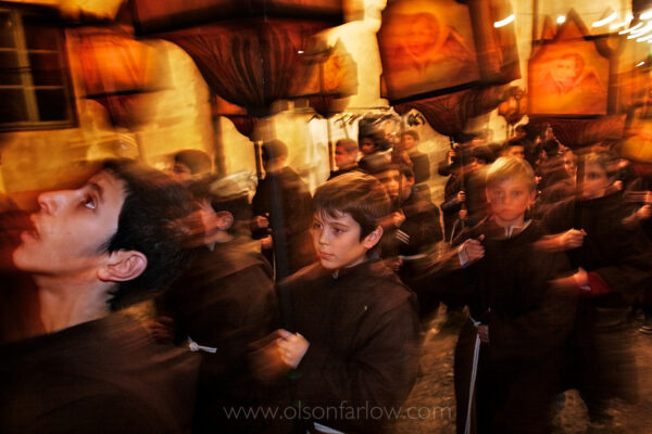 Children carry canvas lanterns, some over a hundred years old that are lit with candles, as they begin a processional on the evening of Good Friday in Mendrisio, Switzerland. The Christian celebration has been held since the 17th century with actors playing the story of Jesus. Costumed Arab slave traders, Jesus and other biblical figures wear historic clothing and create a human tide numbering around 600, as they parade through narrow streets while loud, somber music is played on loud speakers.

