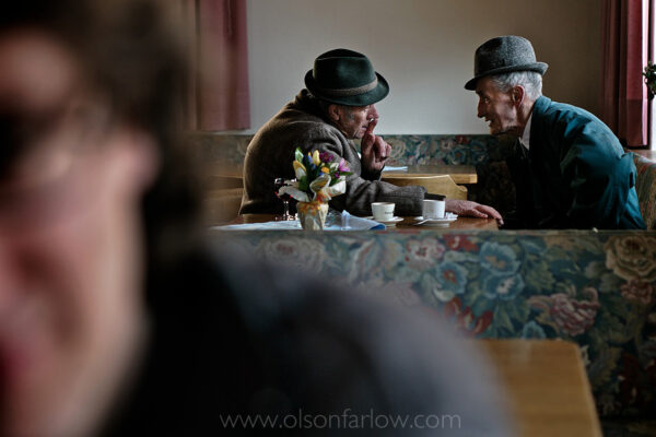 Friends share stories over coffee at a restaurant while waiting for a funeral in La Valle, Italy. People in isolated communities in the Dolomites share a strong Ladin culture that is unique to the Dolomites. The Ladin people have their own language, traditions and even their own cuisine with roots dating as far back as the Roman Empire.
