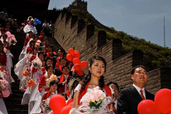 This mass wedding took place at the Great Wall outside Beijing. After reading many surveys about how money was more important than love, I watched and photographed this woman all day. She never smiled.  Marriage can be a great social and financial leap forward for some people.
