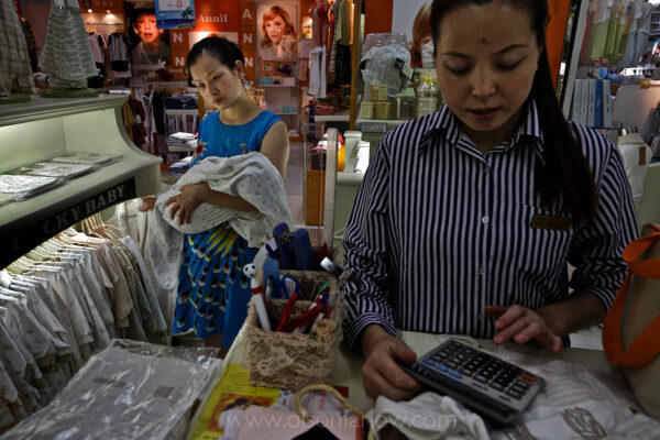 Lu Guo Bao lives with his son and daughter-in-law who is shopping for new baby clothes.
