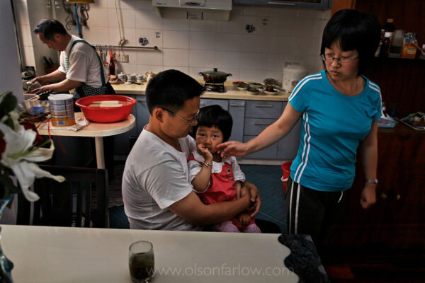 In a complicated family life, the grandparents were farmers and lost the land and their occupations to development. If the couple did not have a child they would be homeless. Ironically, the same development that took his home now supports their daughter, Ding, who works in the industrial park occupying the land that was once the father’s farm.
