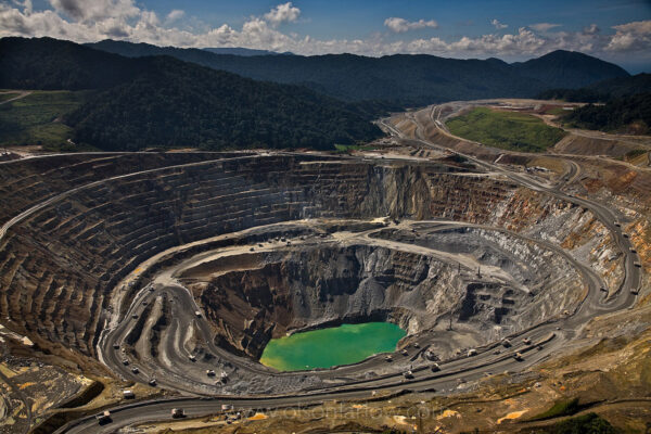 Mile-Wide Batu Hijau Gold Mine Creates Problems | Indonesia
Mile-wide Batu Hijau, a copper and gold mine, generates profits and problems on the Indonesian island of Sumbawa. Opened in 2000 by U.S.-based Newmont Mining Corporation, the huge mine employs 8,000 Indonesians. But the massive amounts of waste rock have buried rain forest. Operators expect gold to run out in about 20 years.
