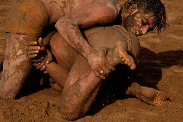 Two wrestlers in a wrestling match outside modern Harappa town. The town of Harappa flourished around 2000 BC because of its location at the convergence of several trade routes from the northern mountains to the coast. Modern Harappa doesn’t have the river trade and settlement patterns have changed away from this area.
