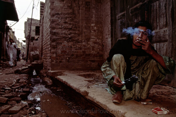 Heroin Addict, Old City | Lahore, Pakistan
A woman in ancient part of Lahore where 5,000 years ago they built the first sewers, squats by the modern sewer to smoke heroin.
