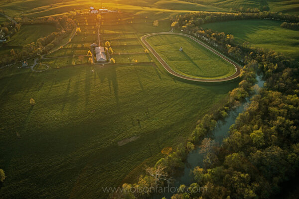 A private training track is positioned on Stone Farm in Kentucky in a picturesque setting. The farm is owned by Arthur Hancock III who grew up knowing horses as he spent time working on his family farm, Claiborne, a respected and successful breeding farm for generations.
In 1970, his father, Bull Hancock sent young Arthur III to run a 100-acre tract known as Stone Farm. It was a farm in microcosm, involving all details of administration and business as well as horsemanship. Like his father, Arthur succeeded. Stone Farm has produced Derby winners and other prestigious bloodlines of thoroughbreds on the rambling, rolling 2,000-acre property.
