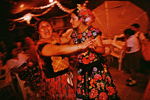 Zapotec Indian women wearing traditional clothing dance into the night at a wedding party in the street of Juchitan, Mexico. Weekends are full of wedding celebrations in the Isthmus of Tehuantepec, the narrow and flat part of the country where the Zapotec culture is still strong. Women are noticeably open and confident, taking a leading role in business and government in matrilineal traditions. The Isthmus never became part of the Aztec Empire and resistance to the Spanish was strong in the mid-1500s. After the church wedding, the couple walks through the streets of town following musicians. They collect family and carry food to where the street is blocked off for the party.
 
 
