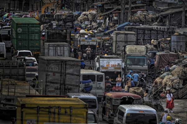 



The Baseco Slums in Manila is known as the Recycling and Plastic Waste Industry hub of the Philippines. Trucks loaded with plastic trucks on the right side of the frame are caught up in congestion in Manila traffic which ranks as some of the worst in the world.  Infrastructure problems, high population and accidents are some of the causes. 




