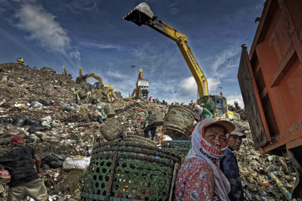 Trash pickers in Bantar Gebang dumpsite outside Jakarta Indonesia work in one of the biggest landfills in the world. Security guards say 100 trash pickers that work around the tractors have died over the course of the dumps lifetime. There are thousands of trash pickers, and the only material they were scavenging was PLASTIC.

