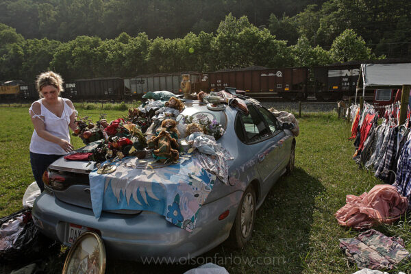 A woman sells household items at an informal flea market set up along the road north of Williamson in Mingo County. Clothes, dolls, and other family items are for sale most any day along the roads near the coalfields.
West Virginians have always lived with the backdrop of the coal train passing by. Money has always gone out of town on that train.

