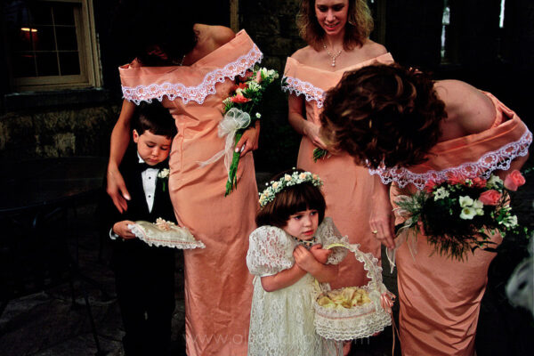 


A ring bearer, flower girl and bridesmaids huddle together on a chilly rainy day before a wedding begins outside the Century Inn in Scenery Hill, PA. The historic inn, once known as Hill’s Tavern, was considered the oldest in continuous operation (since 1794) until a fire destroyed it in 2015. The history marker on Route 40, the old National Road, proclaims the continuous operation but it now has a 2 1.2 year gap between fire and restoration. The detailed repair work was accurately done so the building still qualifies for the National Register of Historic Places.  The village of Scenery Hill is unincorporated and has many antique shops in historic buildings and homes.



