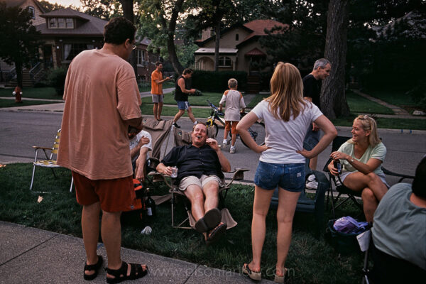 Families congregate for a block party in Riverside, a Frederick Law Olmsted planned community west of Chicago, Illinois. The entire village was designated a National Historical Landmark in 1970 because of its significance as the first planned community in the U.S. The unique original landscaping of the suburban plan still followed today allows for green space and an open rural feeling.
