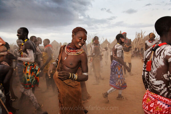 The Ethiopian village of Duss is washed in dust as men and women of the Kara tribe gather for an evening dance. In remote villages, hours away from roads and electricity, celebrations like this provide a shared moment for gossip, courtship, and relaxation. Dances in the Omo River Valley are especially common under a full moon, when the day’s heat breaks and light pours onto the savanna.
