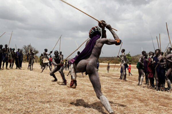 When the Donga fighting begins in the Omo Valley, there is ritualized posturing that culminates with two men beating each other by wailing on their opponent with a penis-shaped weapons. It is an ancient tradition among tribes in Ethiopia that can result in serious injuries when settling disputes. 
