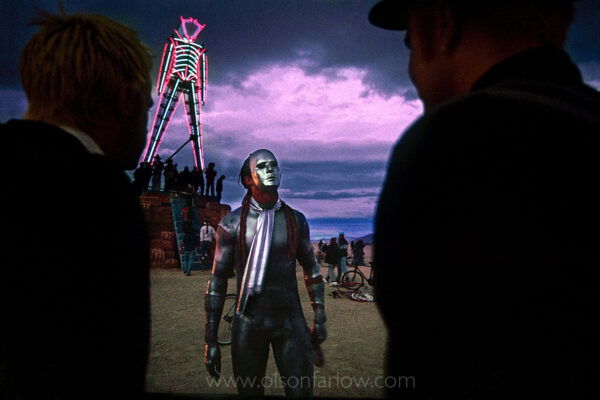 A silver-painted, masked man takes in the evening light in front of the neon, soon-to-be-burning effigy of man at the annual Burning Man Festival in northwestern Nevada’s National Conservation Area. For the week of  the counter-culture happening in the Black Rock Playa, the dry lake becomes one of Nevada’s largest cities, attracting over 50,000 revelers who come to make art in the desert.
