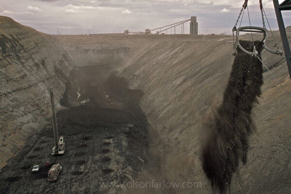 The Black Thunder Coal Mine in Wyoming’s Powder River Basin is the largest surface coal mine in the country. The dragline uncovers the earth down to a coal seam with a bucket that holds 170 cubic yards of rock.
Trucks are filled with coal which is then transferred to trains that haul it to power plants in tMissouri, Illinois and Tennessee. Approximately 91 tons of low sulpher coal is extracted from the mine annually.
The coal company employed over 500 workers at Black Thunder, which is regulated by the Bureau of Land Management and for many years was the nation’s single largest coal mine.
Five draglines work the 70-foot Wyodak seam, producing more than 65 million tons of coal annually on federal land. Once the low-sulfur, sub-bituminous coal is crushed it is suitable for power station fuel without any other preparation.
The Black Thunder Mine produces more than two tons of coal per second, 24 hours a day, 365 days a year. According to Arch Coal Company, the mine surpassed a 750 million ton shipment milestone 25 years after opening in 1977.
