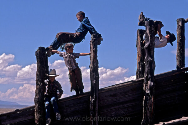 Children turn a cattle chute into a homegrown playground on the Roaring Springs Ranch, near Steens Mountain in Oregon. The young cowpokes learn to ride horses when they are young and help move cattle on the ranch.
Ranch families in the twenty-first century face many challenges, from competition with government-subsidized agribusiness corporations to tax laws that encourage development over agriculture and prevent the smooth transfer of land from one generation to the next.
Ranch families play a critical role in the U.S. as a stabilizing force in the American West.
