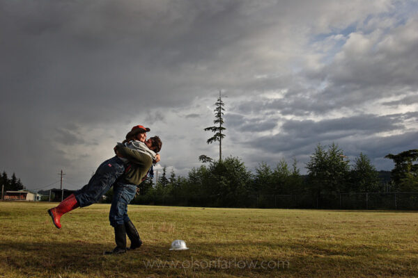 A couple dances to celebrate a win in the annual logging show held in Thorne Bay on Prince of Wales Island in the Tongass National Forest. The southeast Alaskan competition is the “real thing”—not a tourist show—where loggers, former loggers, and “wannabe” loggers compete, climbing trees and sawing timber.
