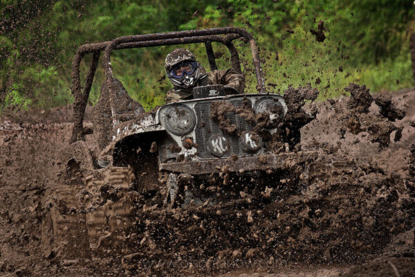 Drivers of four wheeling, off-road vehicles compete while sliding through a slippery race course of muck at a weekend mud bogging contest on Prince of Wales Island.
When the timber industry took a downturn, the town of Naukati (population 150), was depressed and hired a consultant who advised them to have an annual festival.
After the Skunk Cabbage Festival was started, they added the mud bog and now that is the big draw for tourists and locals. Naukati Mud Bogg races are the largest off-road event in southeast Alaska. Drivers compete with each other to beat the clock as they drive through a water-logged muddy course.
 
